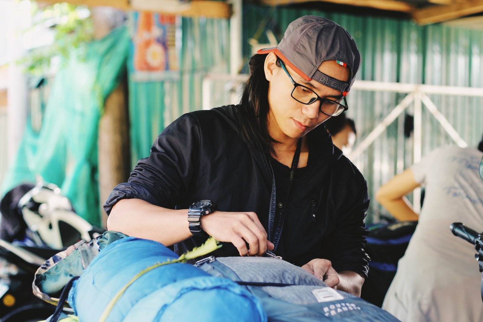 Runner preparing lightweight clothing and first-aid items