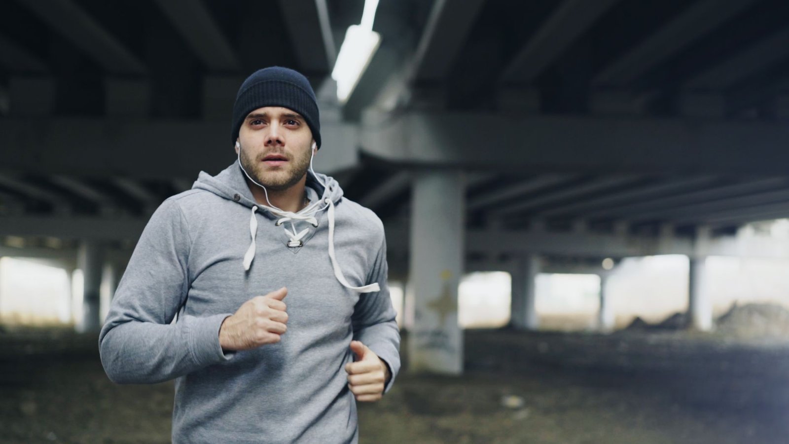 Coach guiding resistance band lateral walks for better form