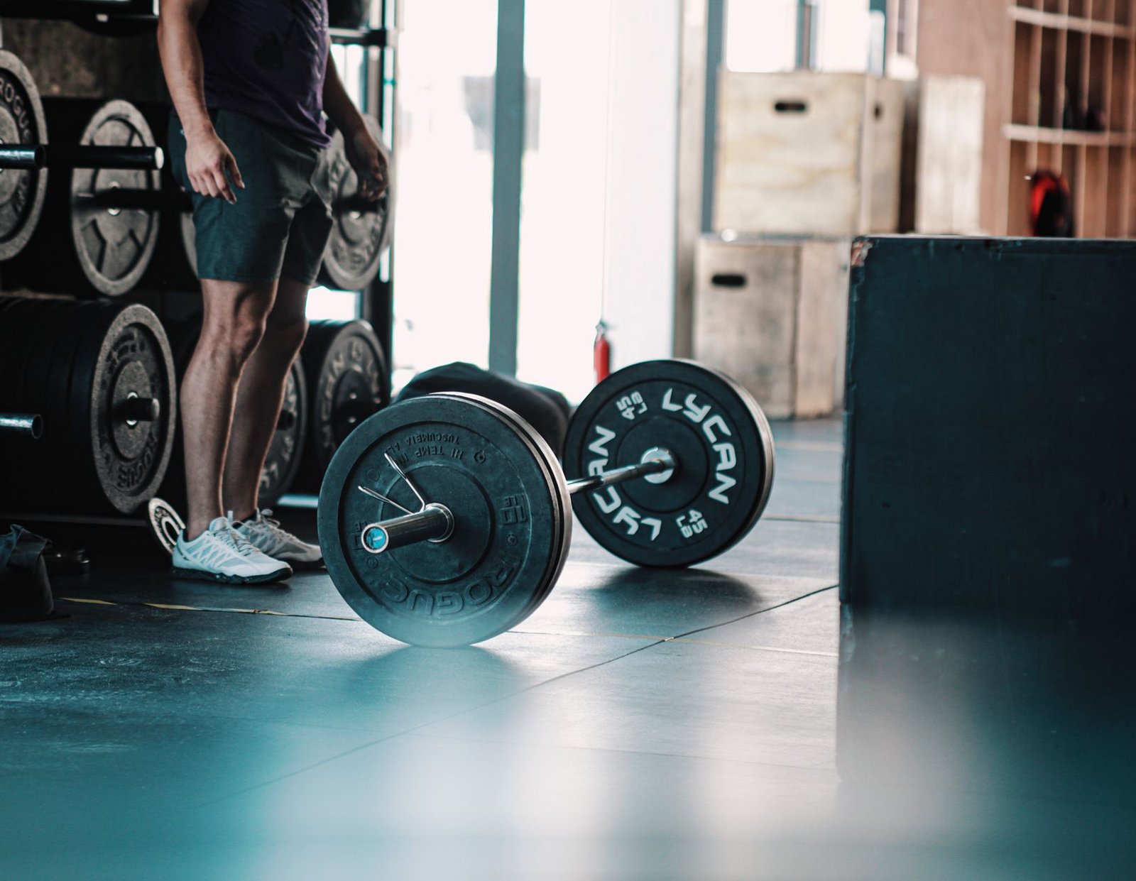 Runner doing kettlebell exercises for lean muscle definition
