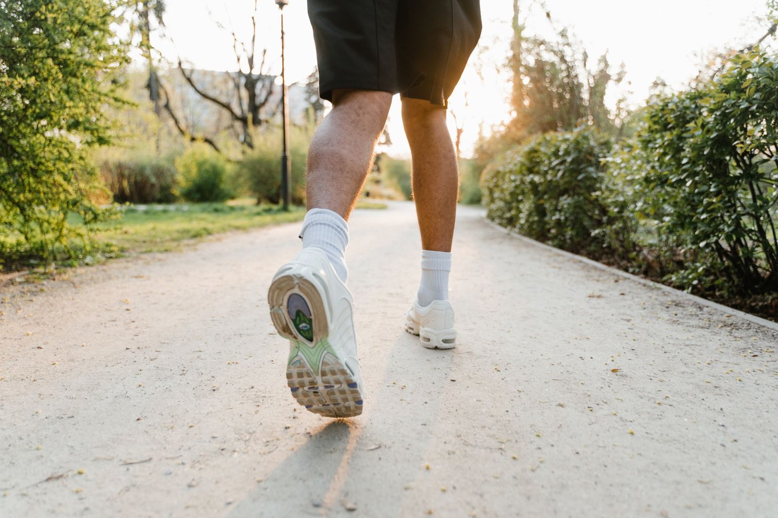 Athlete trying seamless socks with low-cut marathon sneakers