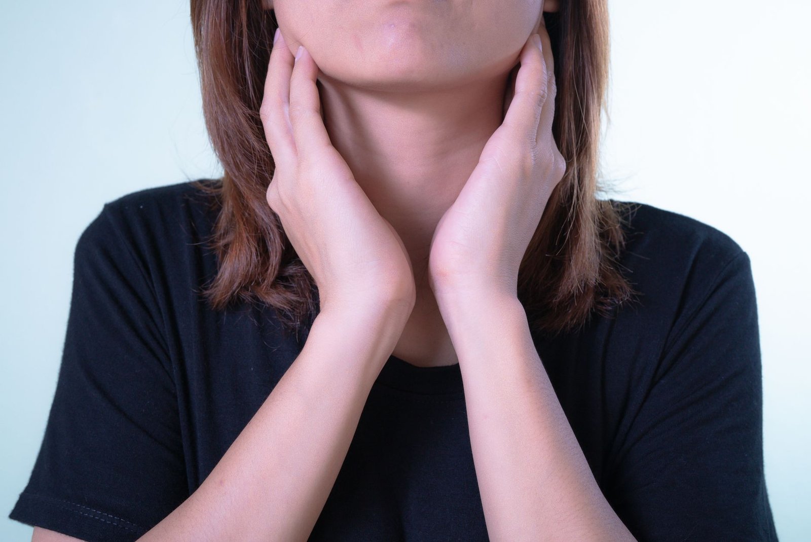 Close-up of a runner drinking water for dry throat relief