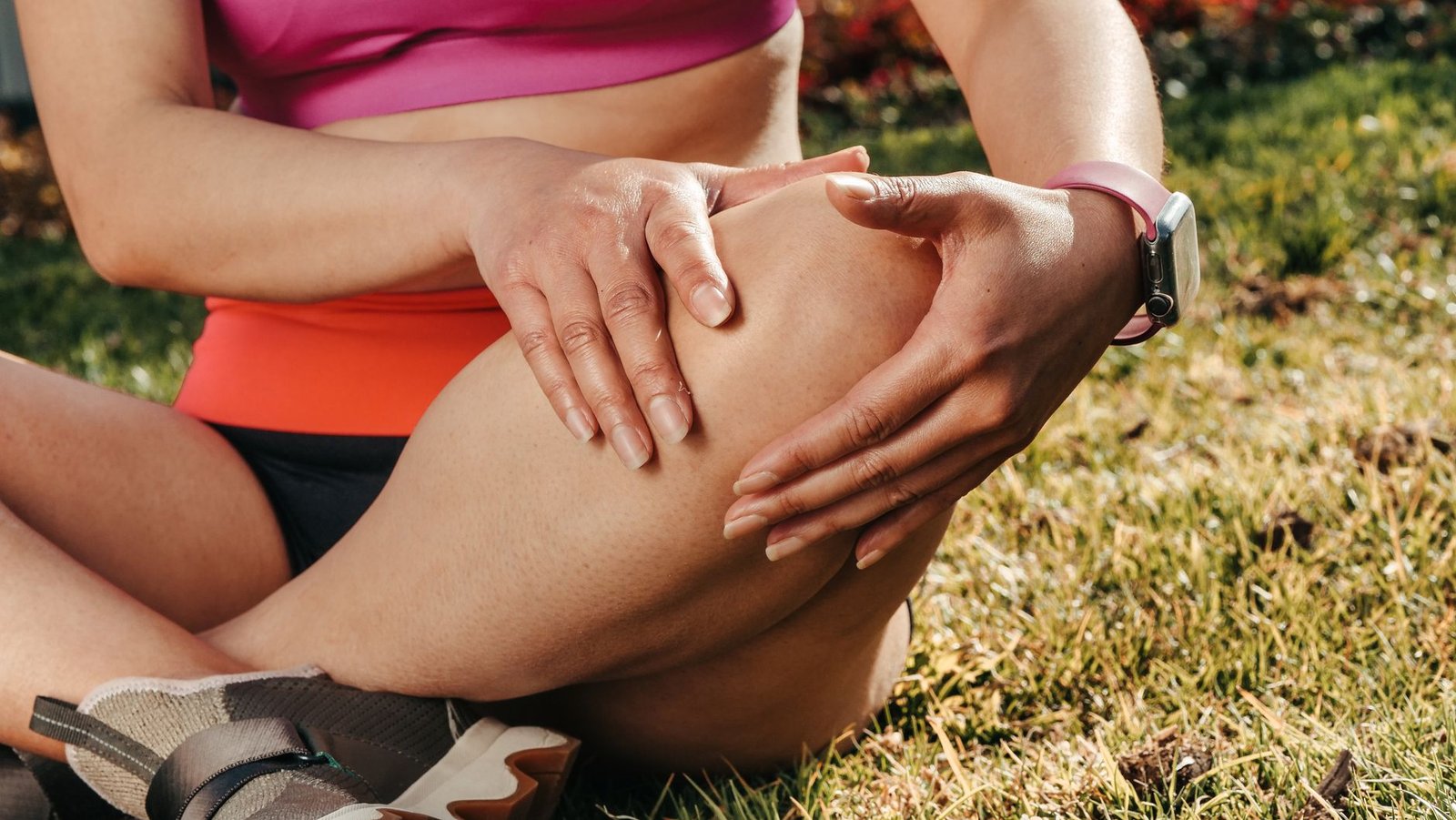 Runner using foam roller to ease tight quadriceps muscles