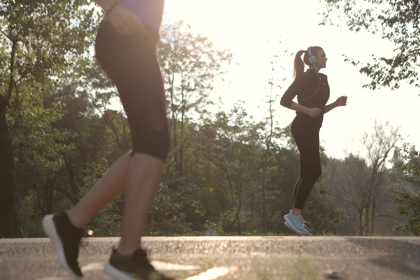 Coach demonstrating proper gait to avoid overstriding
