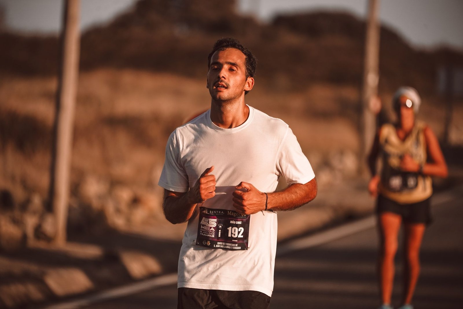 Athlete checking bedroom routine, dim lights and cool room