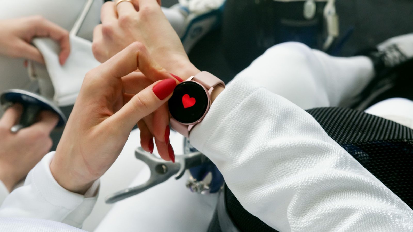 Technician cleaning optical sensor after sweaty race conditions