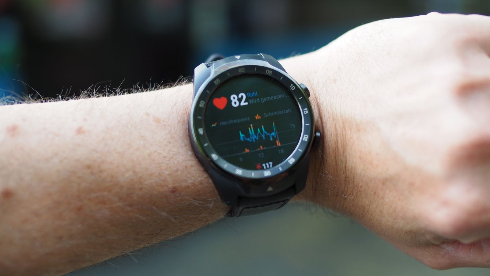 Hands testing watch fit and recalibrating heart rate monitor