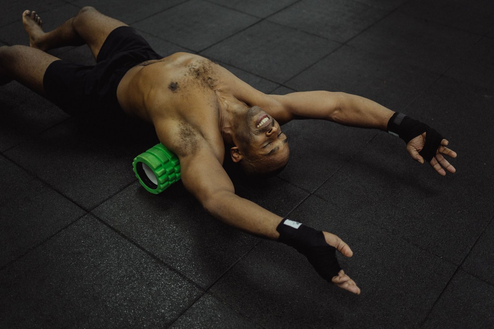 Athlete targeting relief with foam roller on lower legs