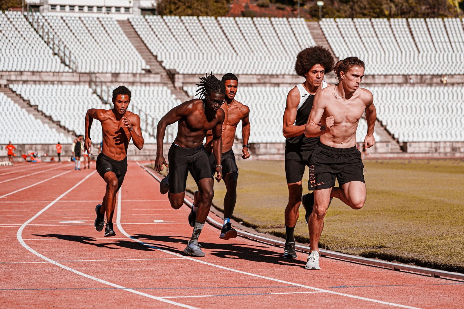 Athlete jogging recovery down hill after sprint set