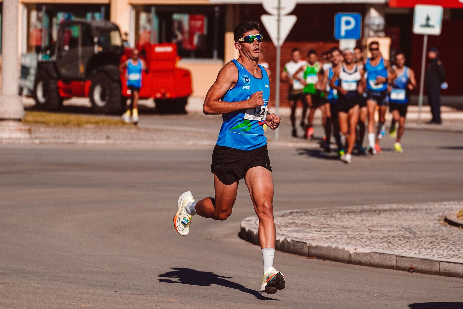 Athlete sprinting through distance markers with split timing