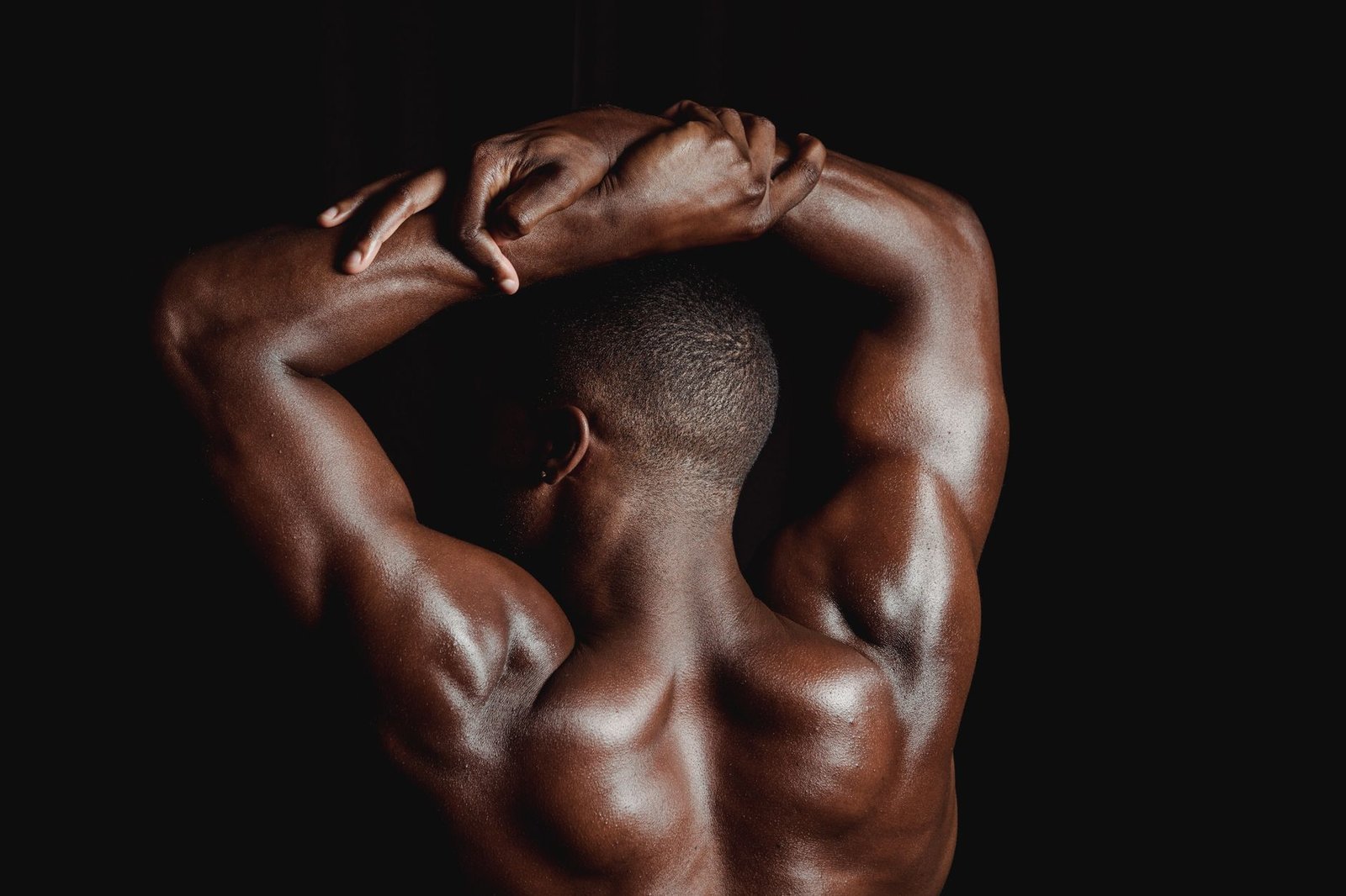 Trainer guiding dumbbell rows to strengthen upper back