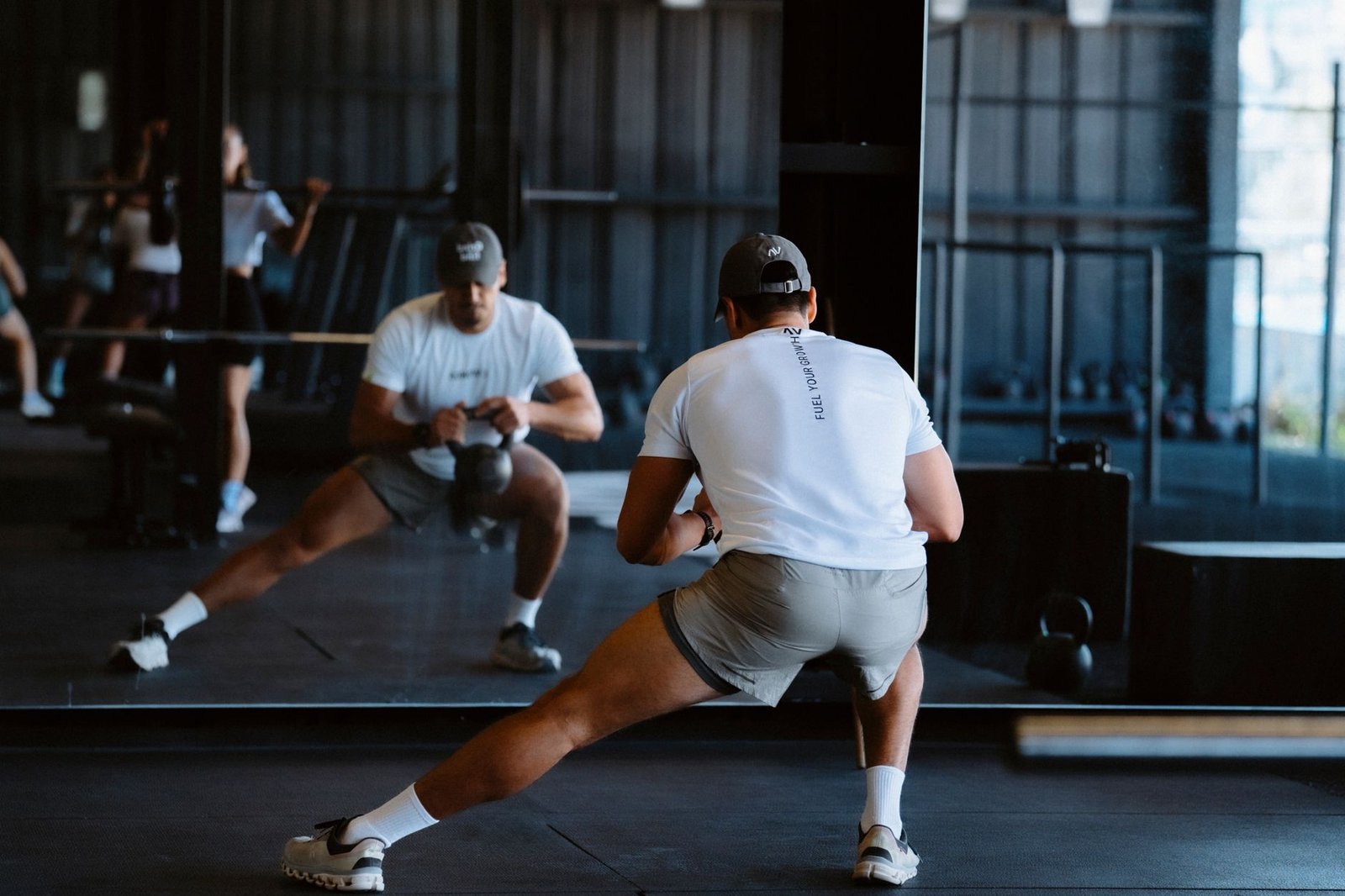 Runner practicing heel drop mobility for ankle flexibility