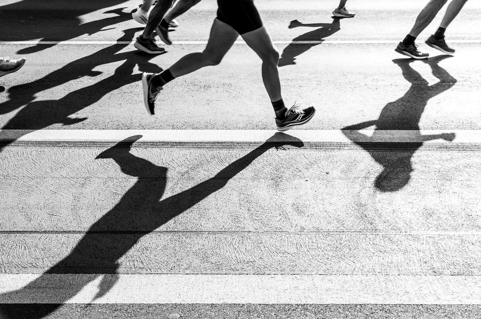 Athlete compares fresh and old shoes for marathon readiness
