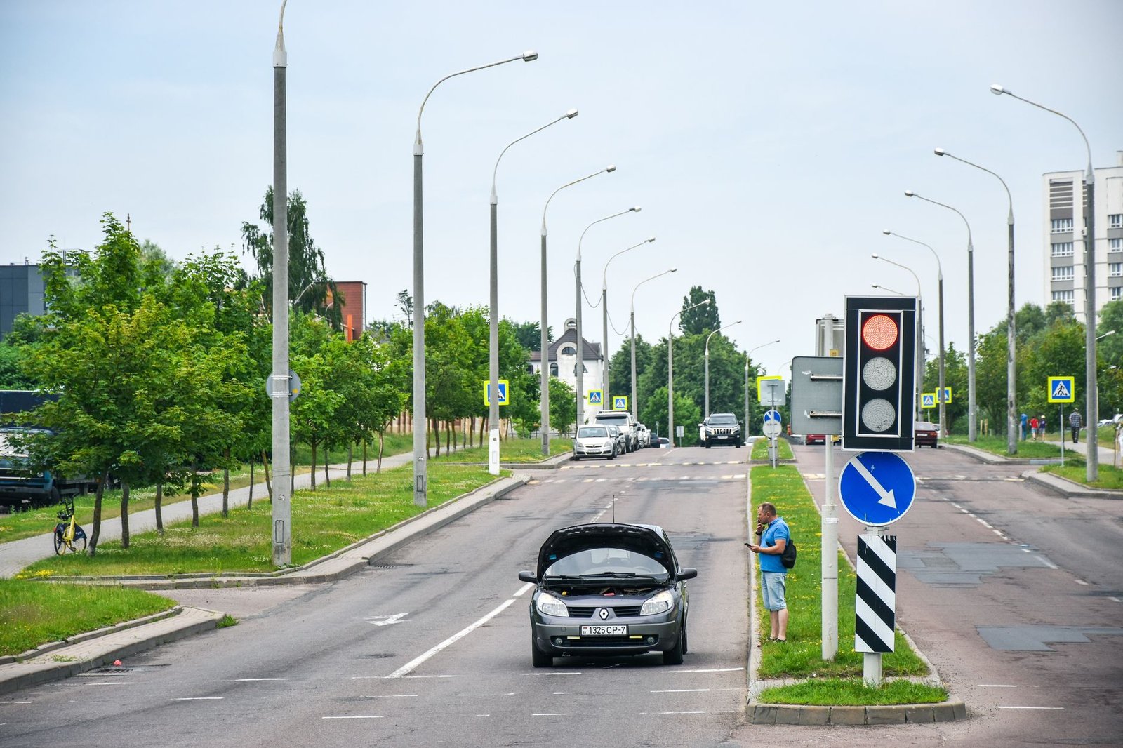 Driver maintaining steady pace through traffic light intersections