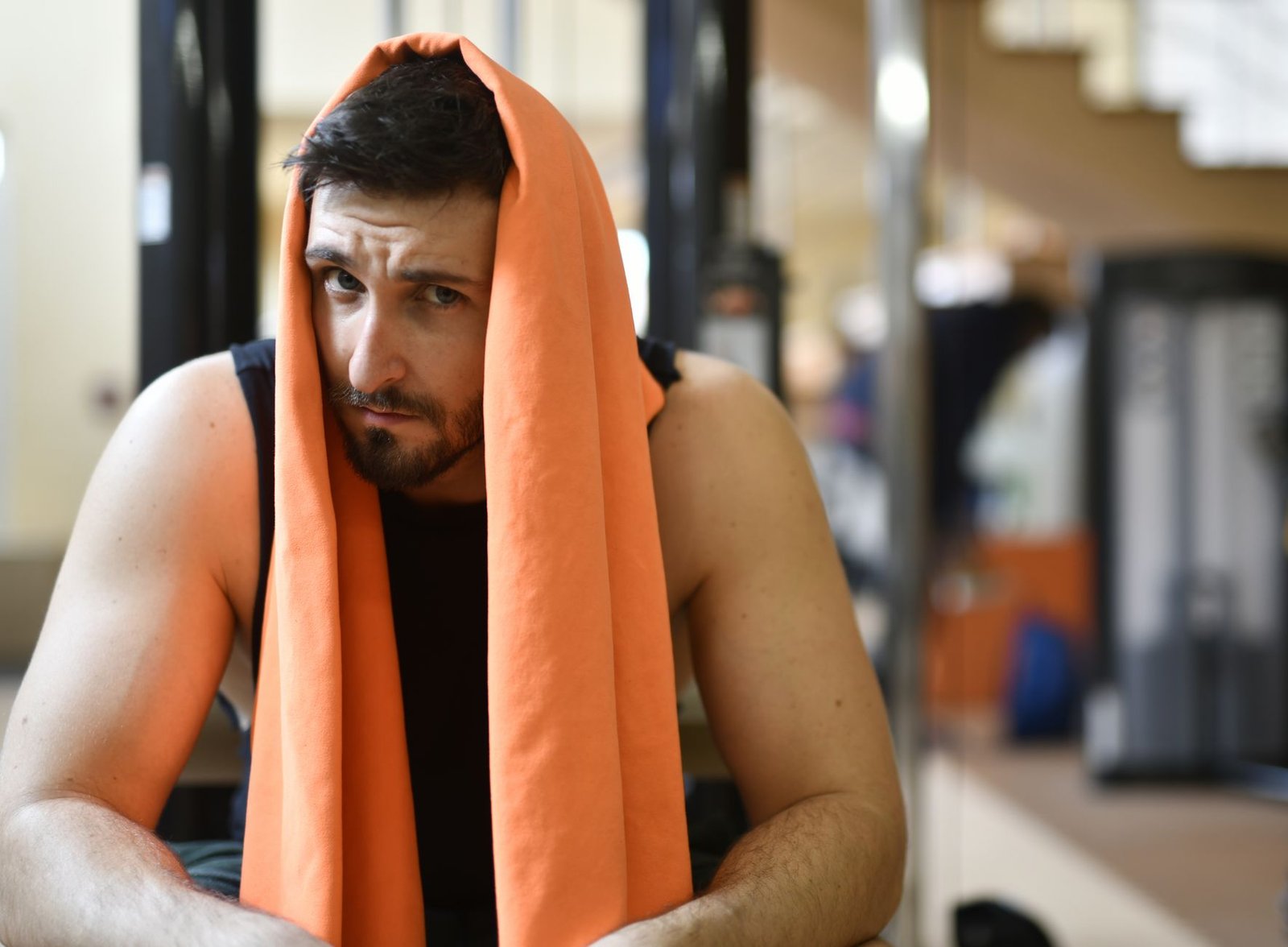 Coach monitoring heart rate during workouts for proper recovery