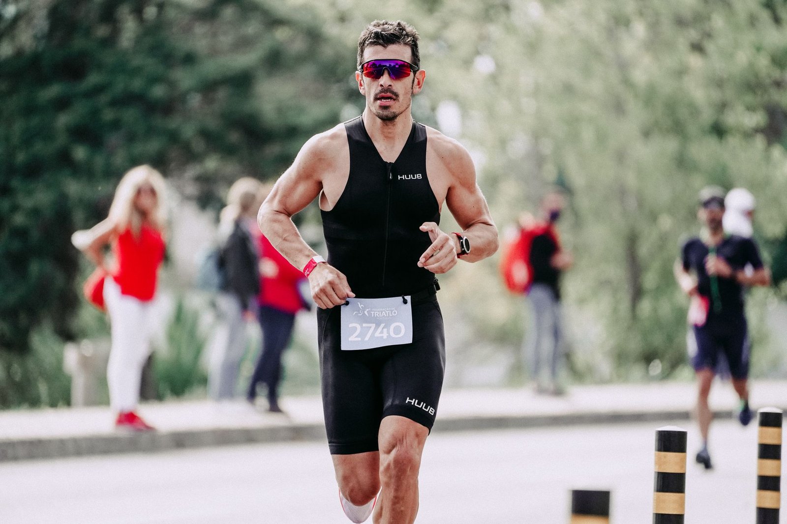 Runner adjusting marathon suit fit and fabric layers