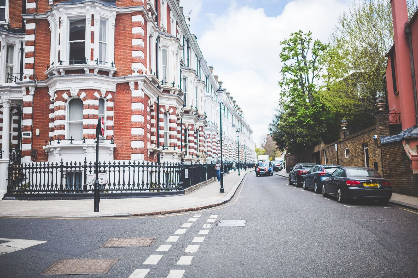 Road cyclist wearing helmet on quiet London descent