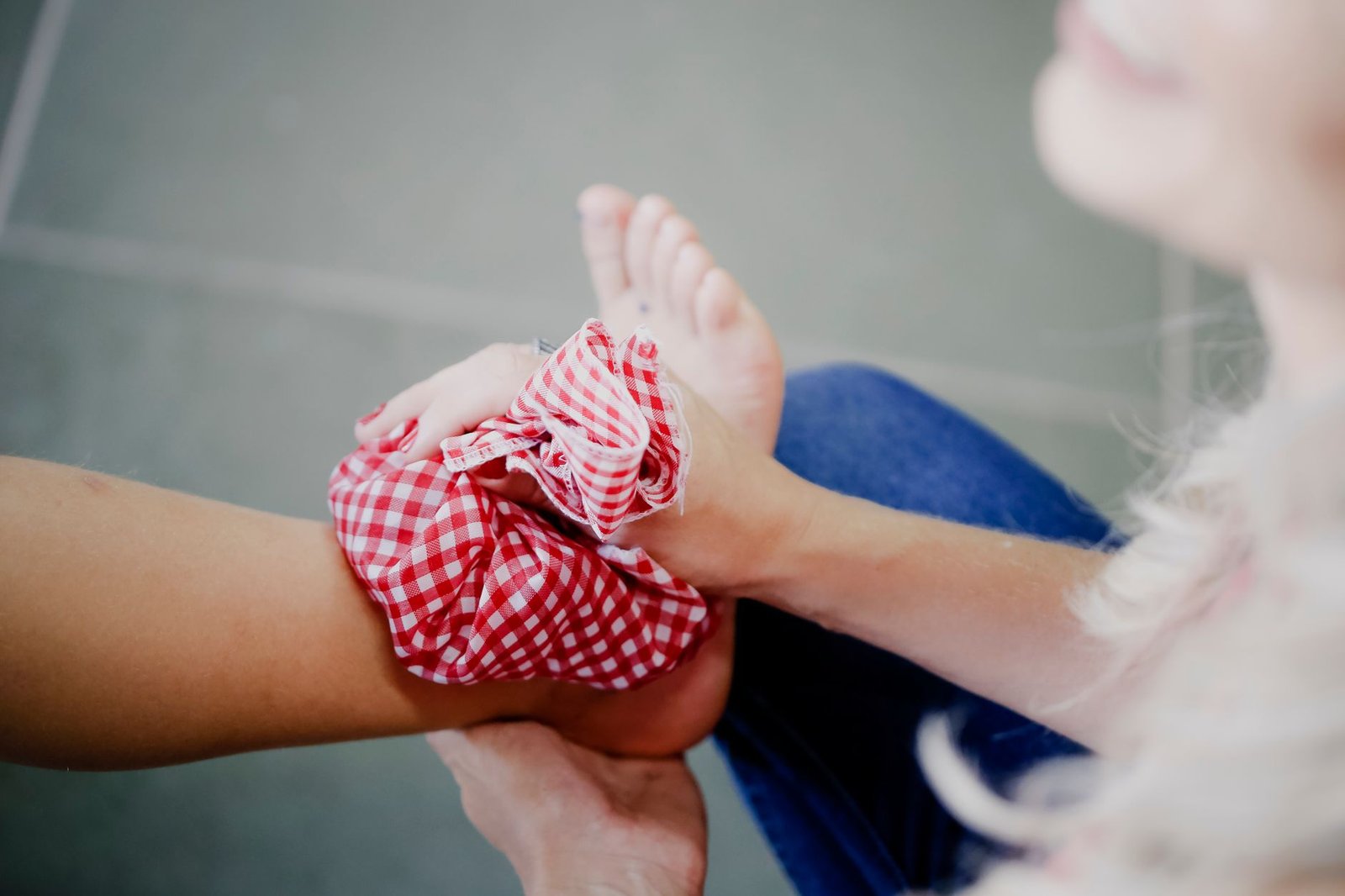 Close-up of ankle with compression sock and elevated leg