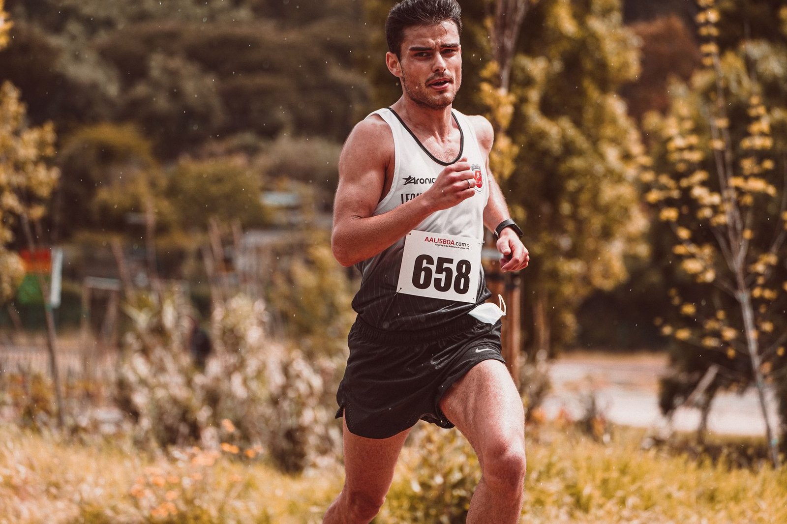 Coach setting rest times for high-intensity workout sessions