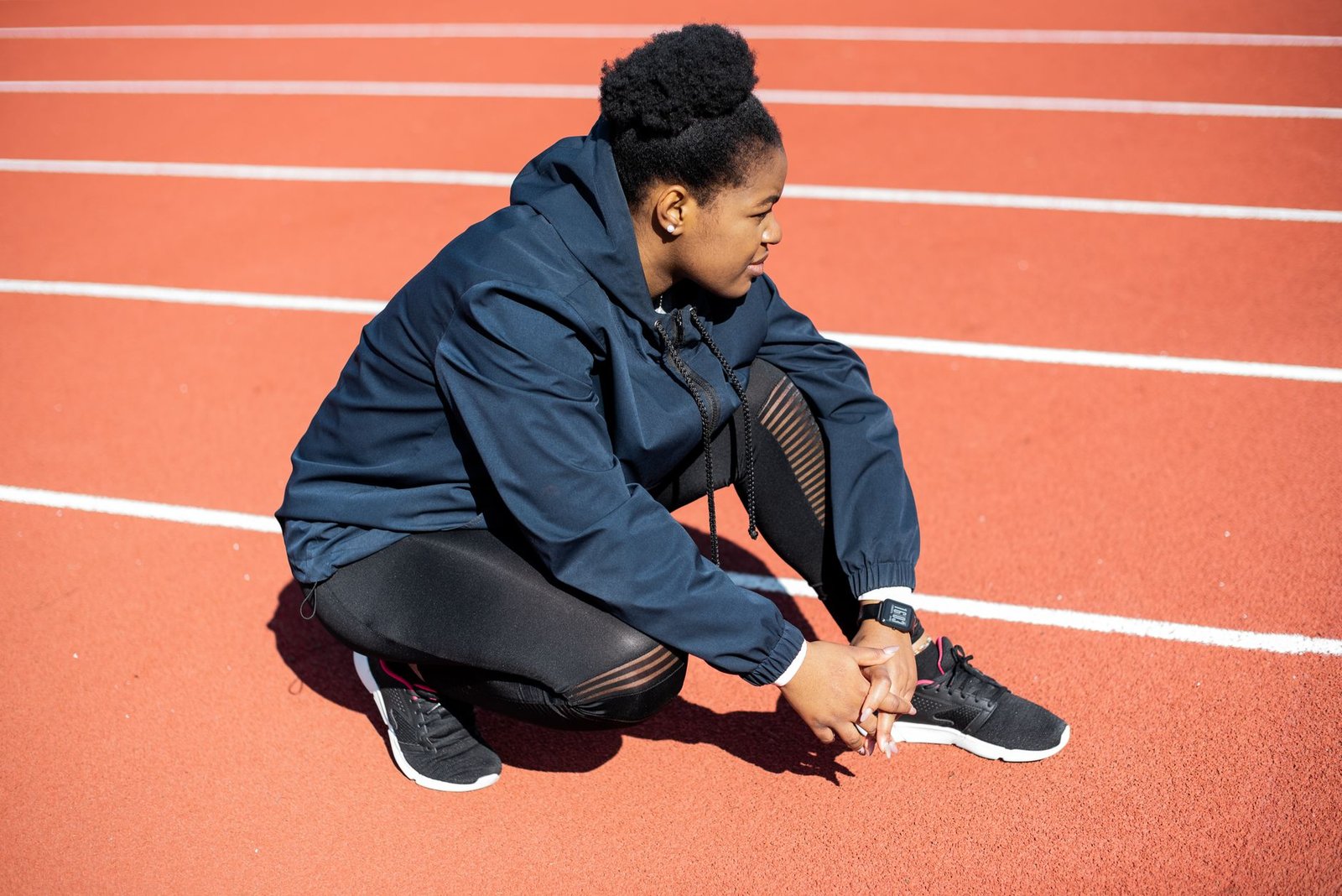 Athlete doing gentle warm-up stretches after recovery phase