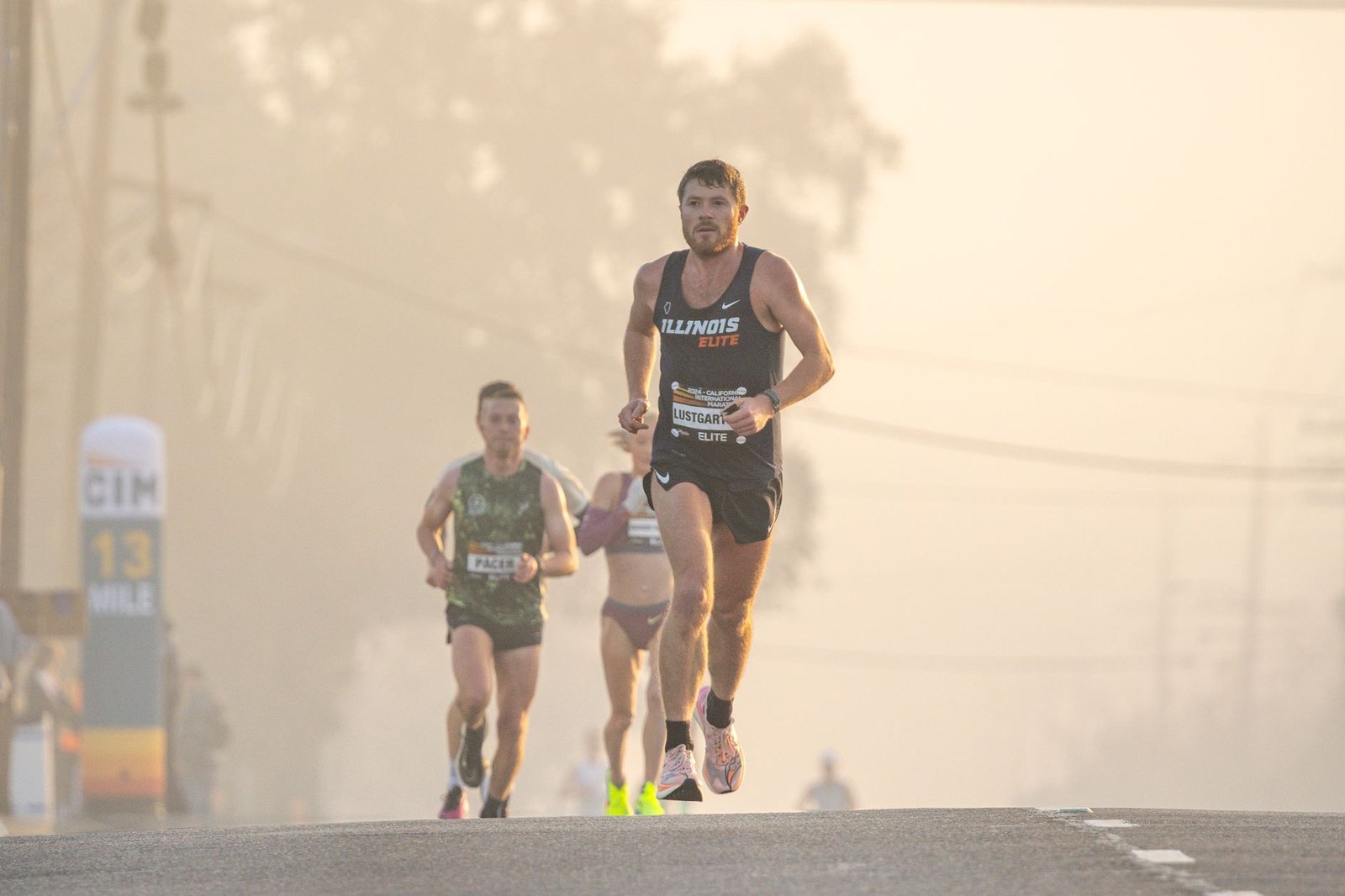 Runner checking pace targets before starting a race