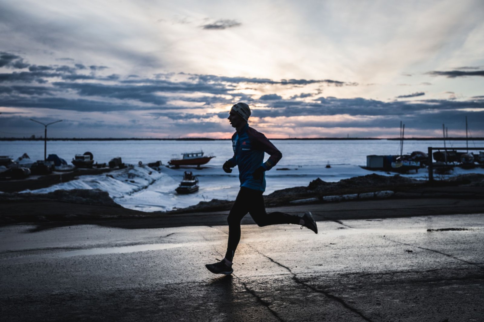 Runner applying warm compress to muscles post-run recovery