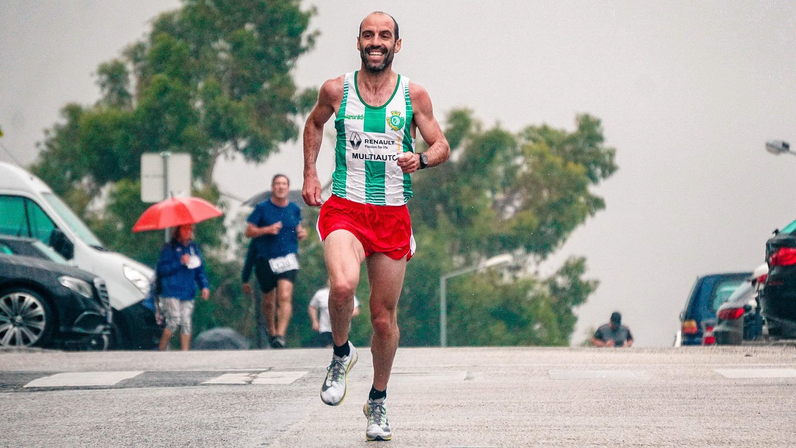 Running in strong wind, leaning forward against gusts