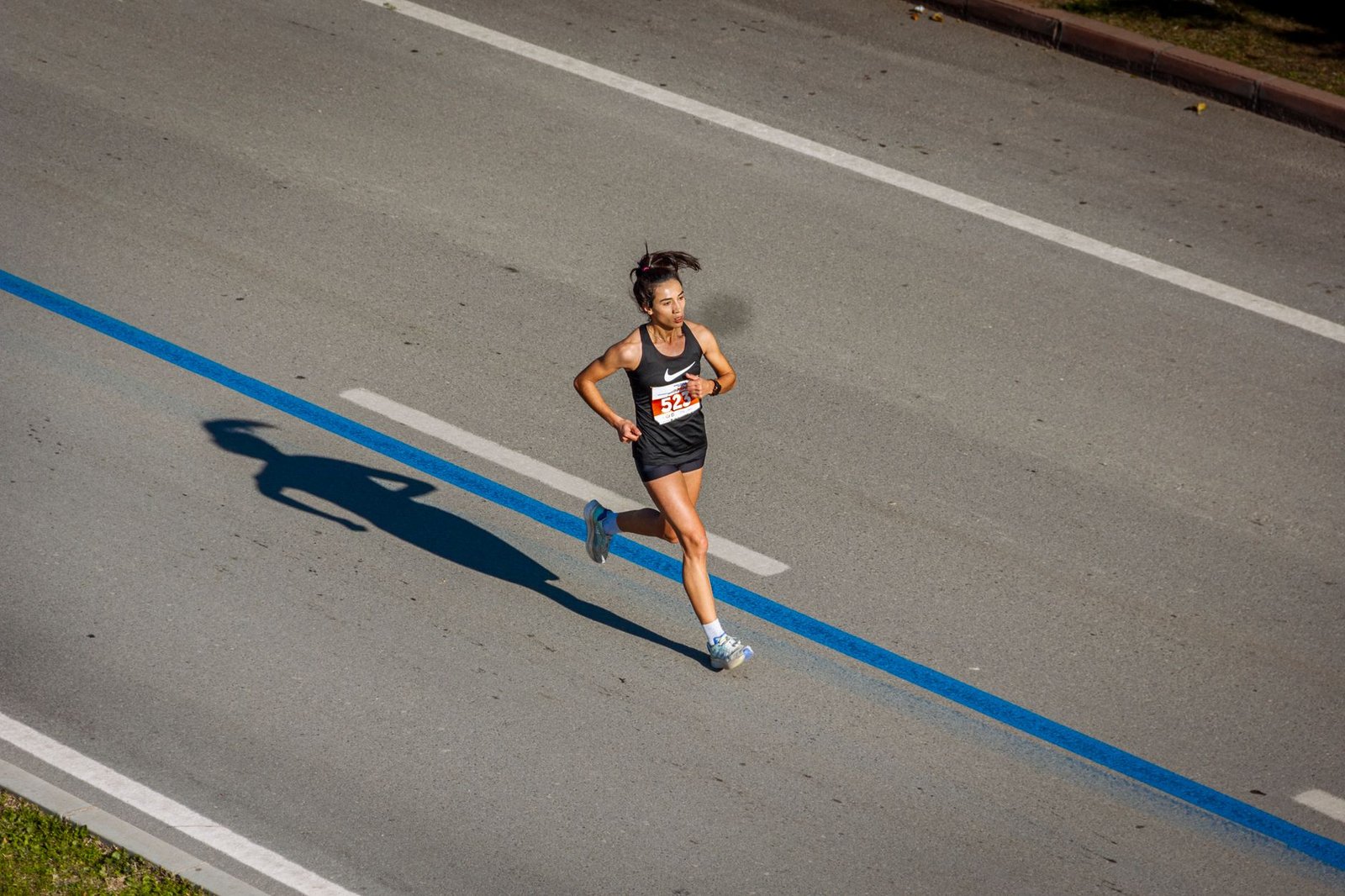 Coach reviewing marathoner notes on training diary table
