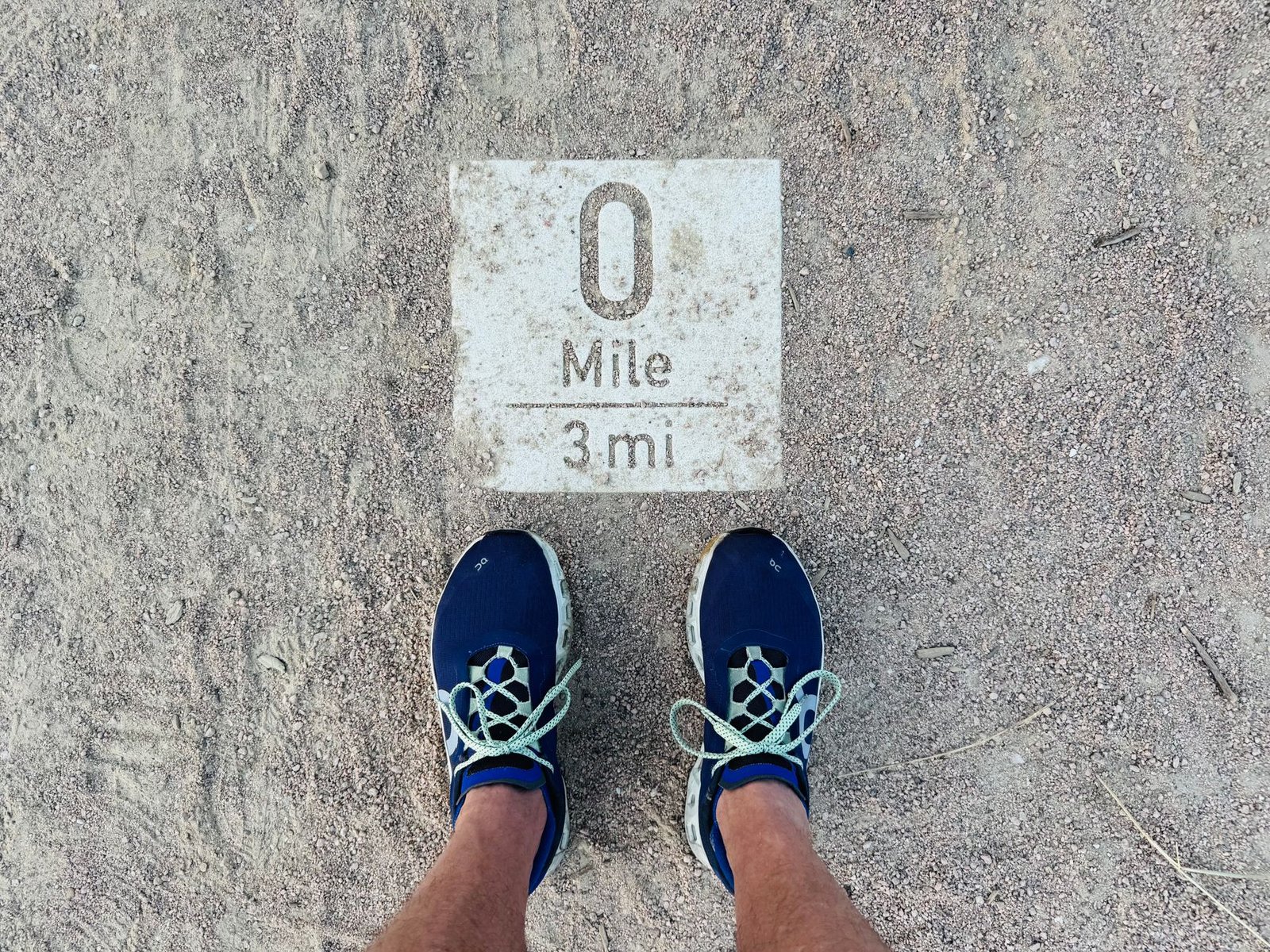 Runner practicing breathing technique to ease pre-mile one heaviness