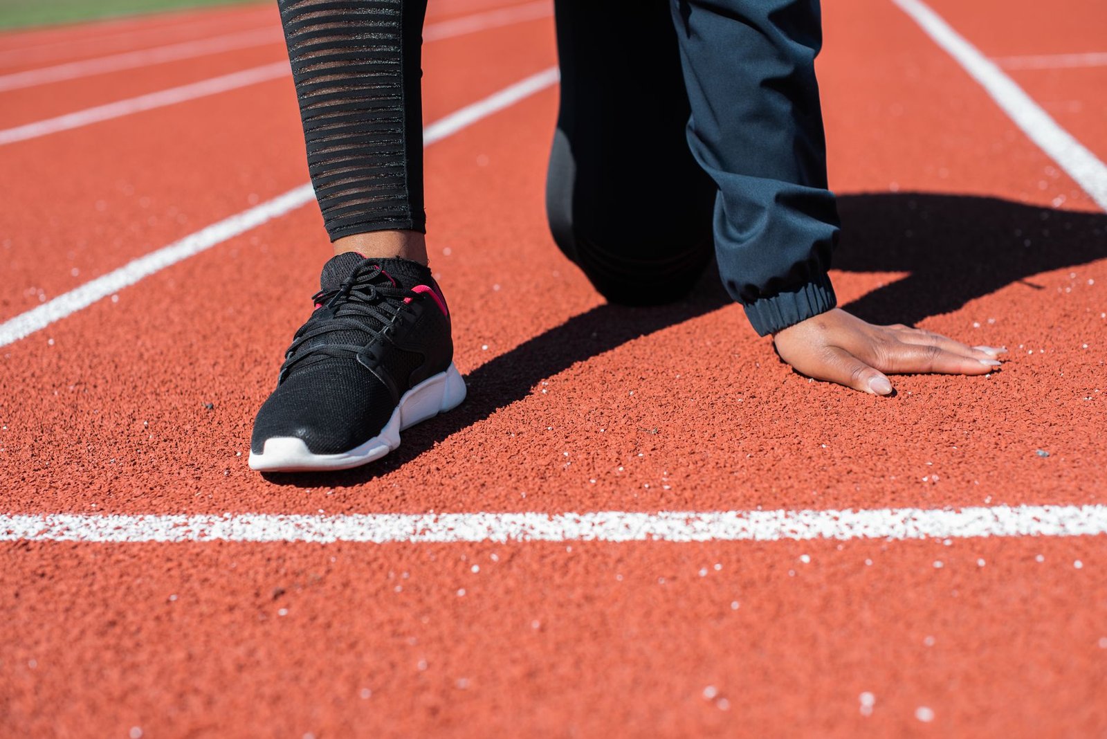 Athlete practicing light jog and drills before starting