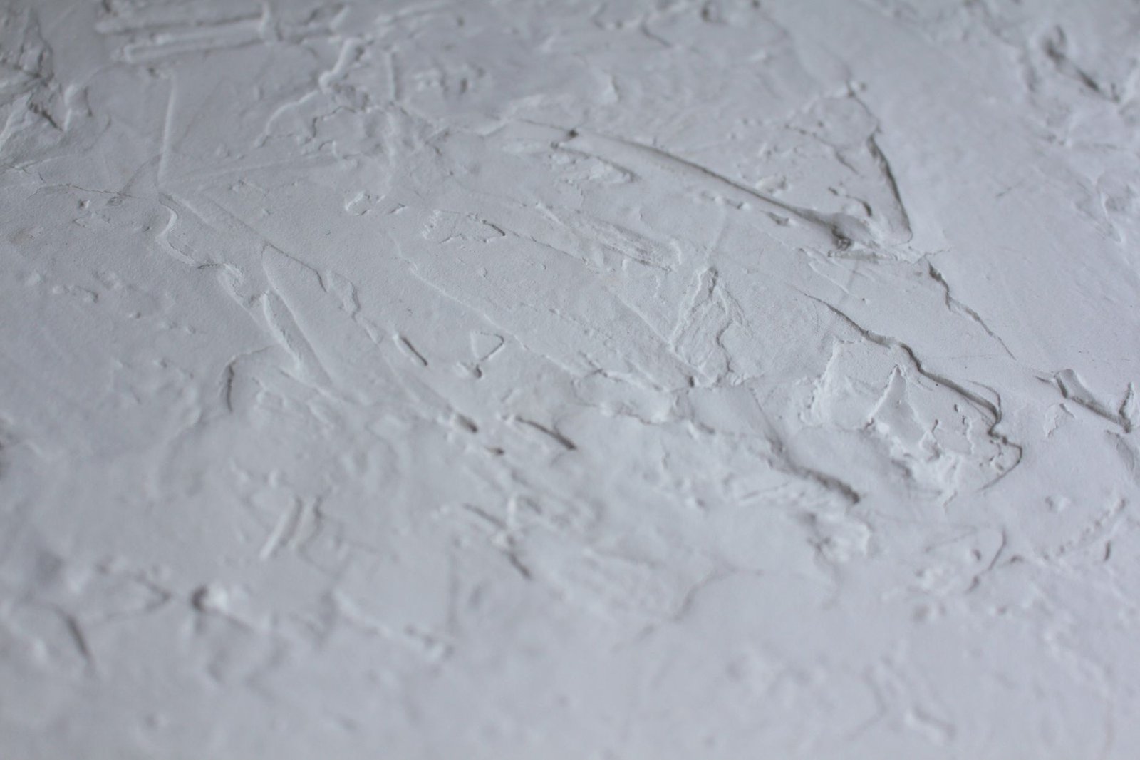 Close-up of cracked pavement affecting runner stride in London