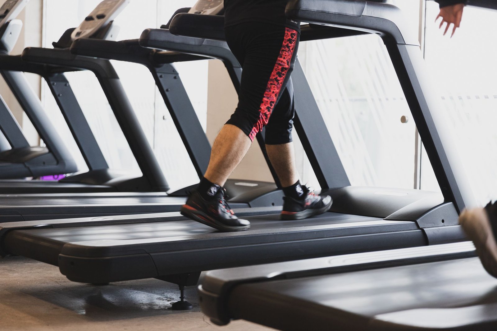 Trainer guides interval workout setup during London winter season