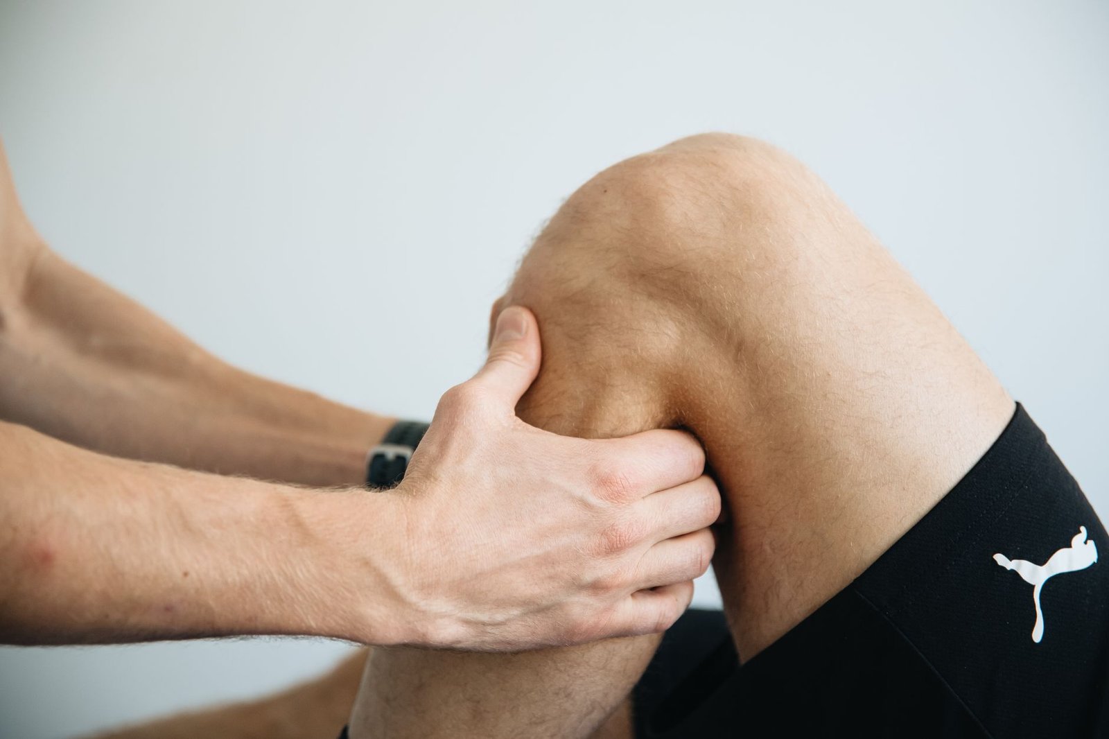 Physio guiding warm-down routine in London studio room