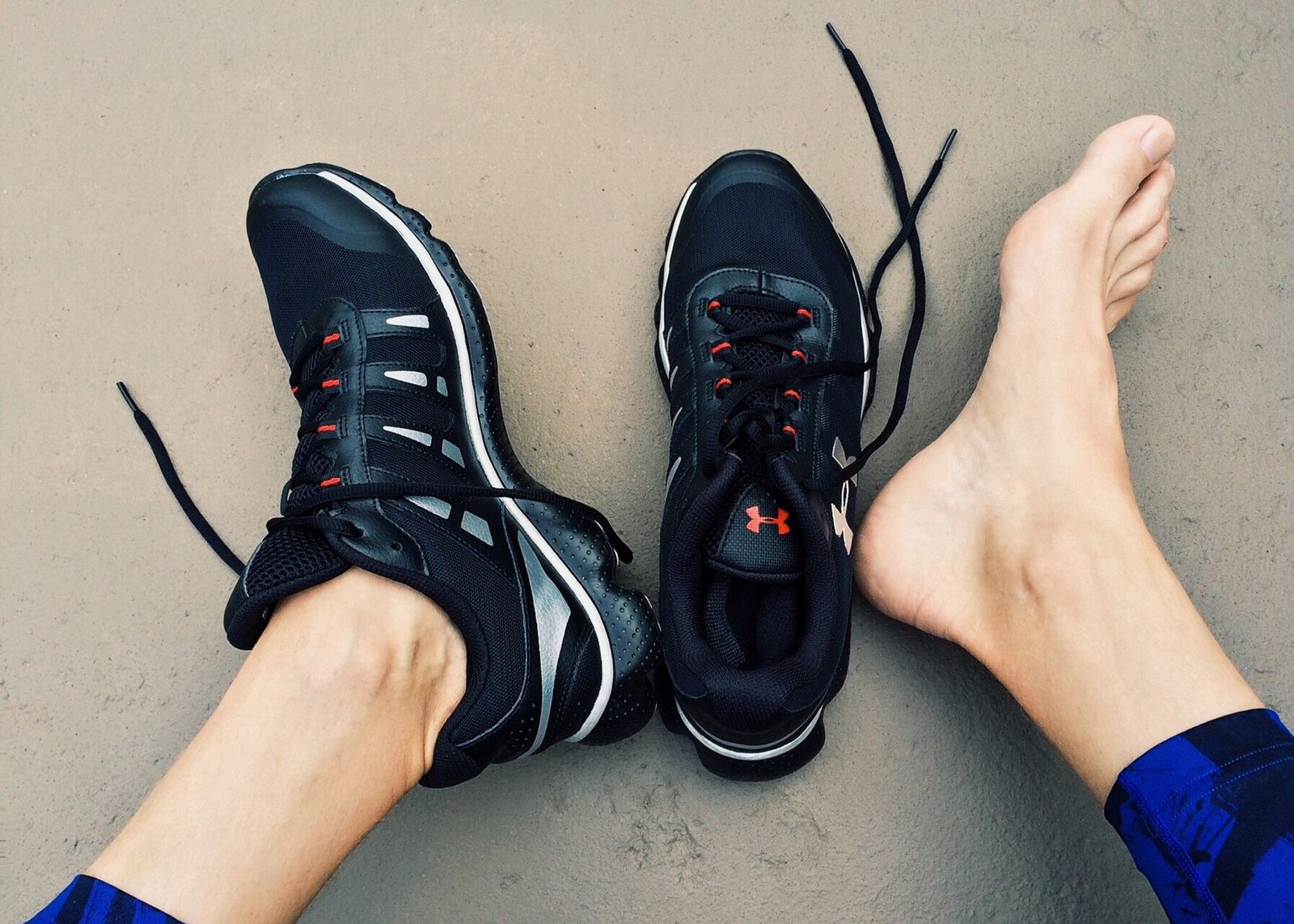 Hands adjust laces during shoe fit check before travel