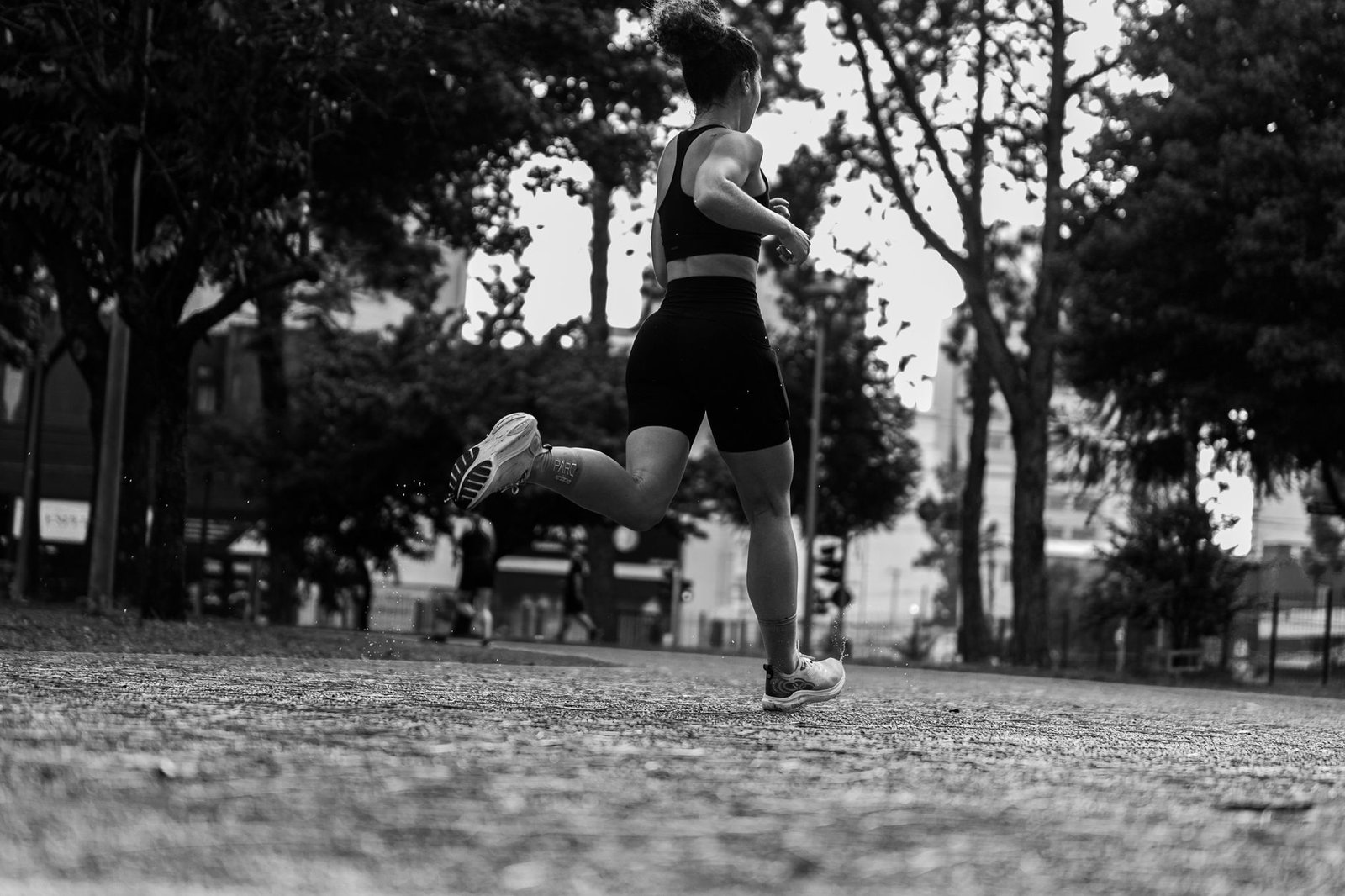 Coach guiding form during lower-body strength exercises