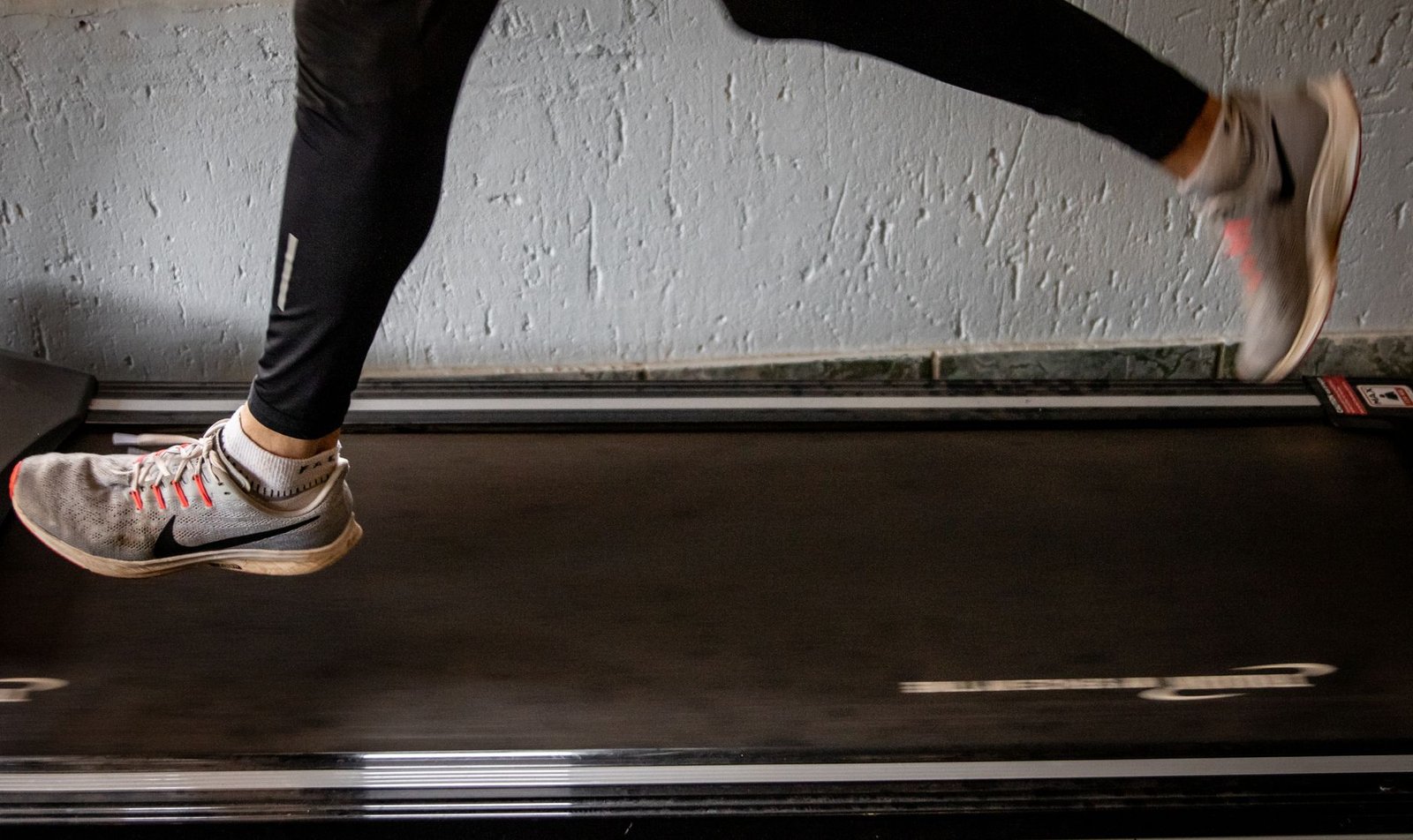 Runner warming up before safe lifting workout in London