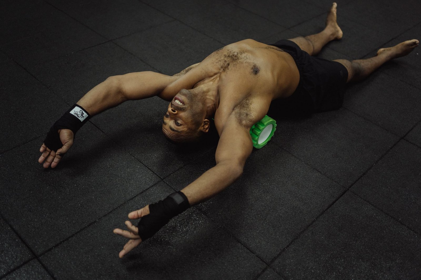 Massage therapist relieving muscle tension after marathon training