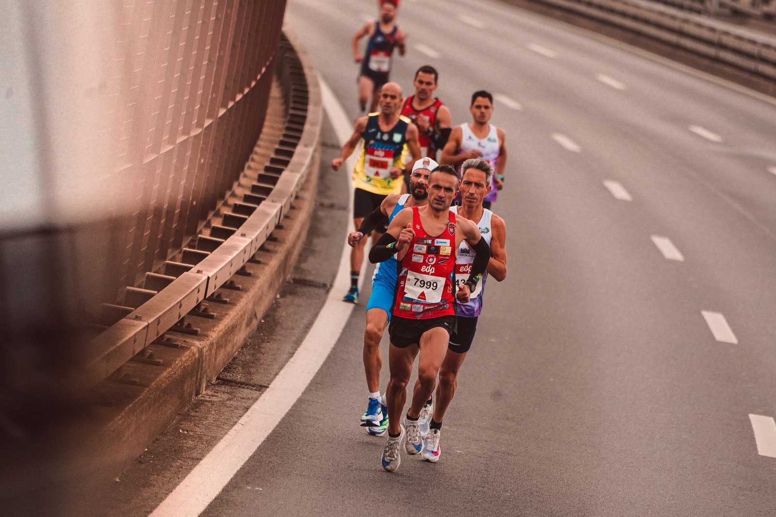 Physiotherapist guiding hip mobility exercises during marathon preparation