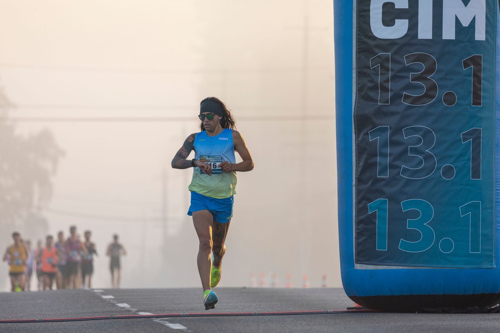 Marathoner hydrating and timing fueling to prevent fade