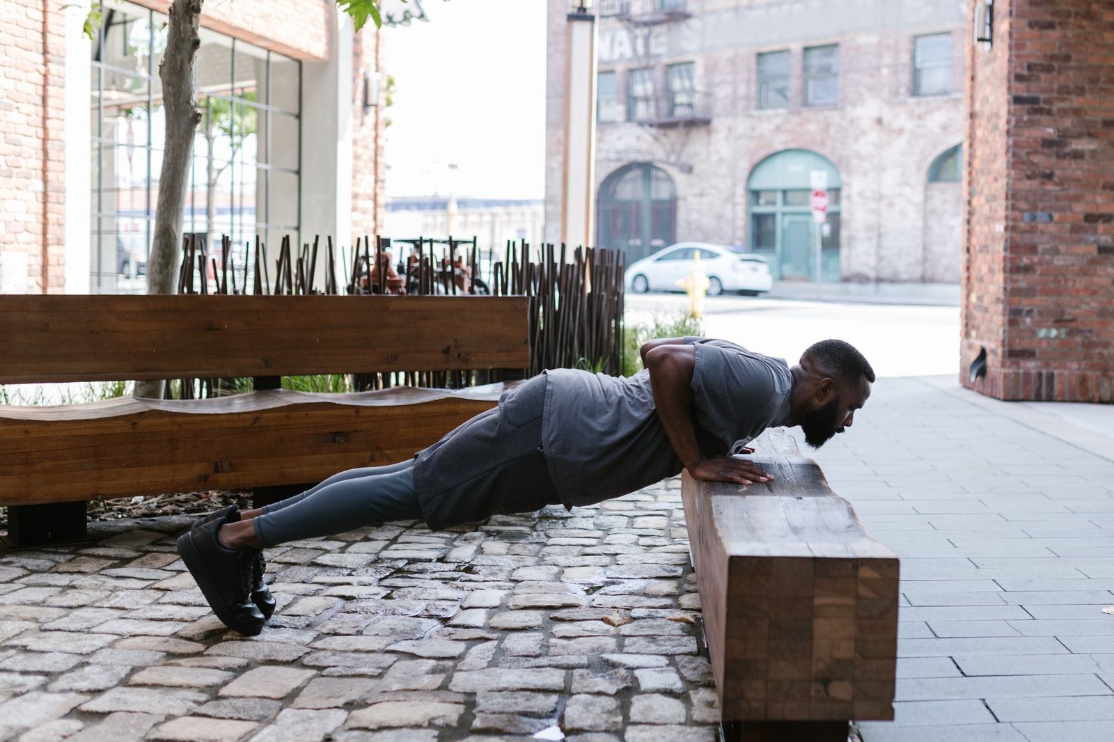 Outdoor strength routine in London green space at sunrise
