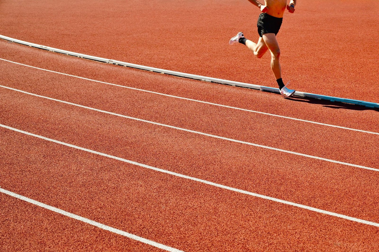 Close-up of athletic shoes showing improper alignment patterns